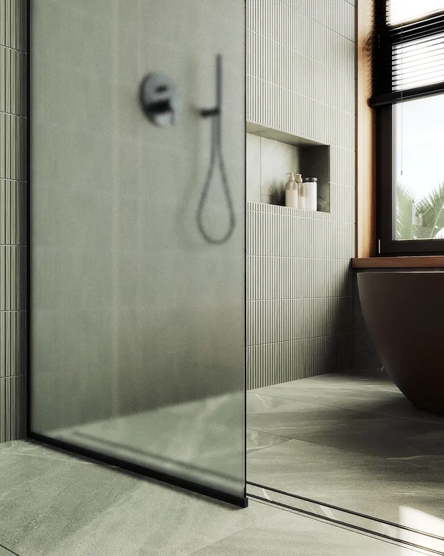 Душевая перегородка MaybahGlass в узком профиле, 195x69 см, стекло сатин/черный — на фоне серой плитки и окна с видом на растения